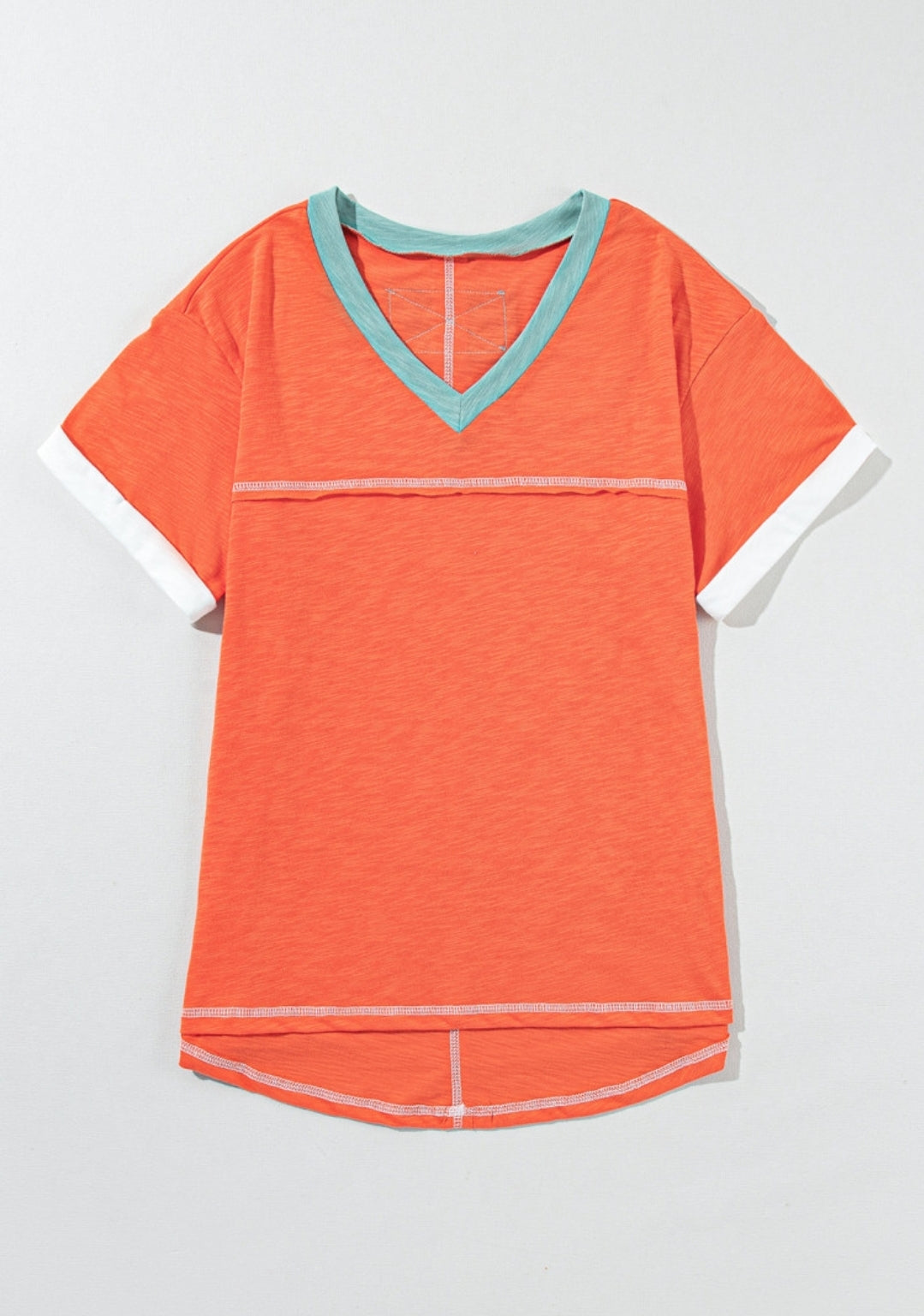 Orange tee with aqua trim around v-neck & exposed seams